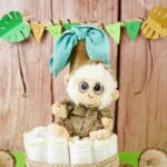 Diaper cake in front of wood wall