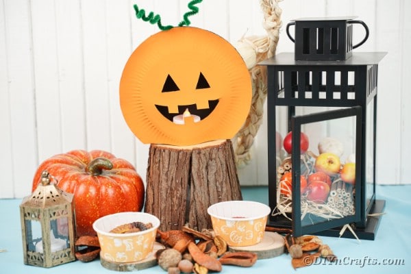 Paper plate pumpkin by halloween decor
