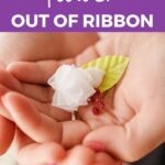 Woman holding miniature ribbon flower