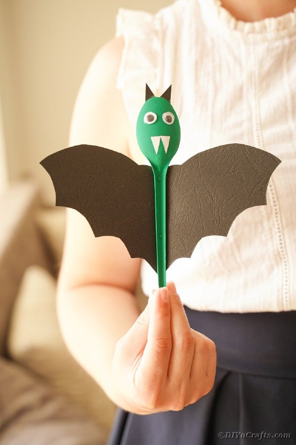 Woman holding spoon bat