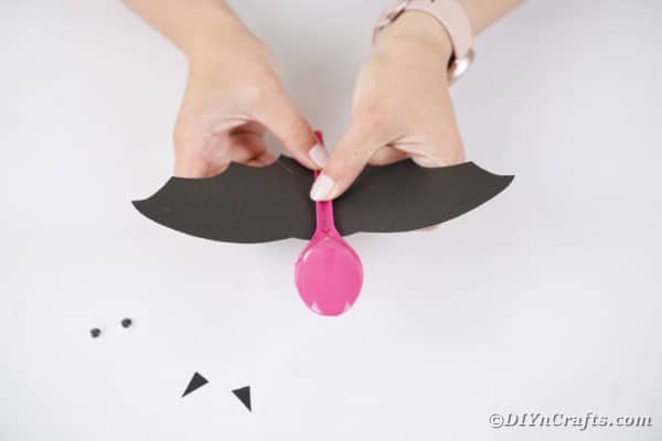 Gluing spoon to bat wings