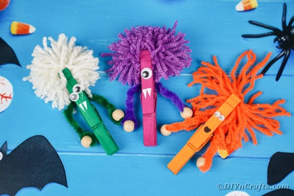 Clothespin monsters on blue boards