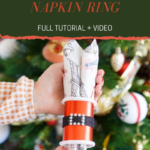 Santa napkin ring in front of Christmas tree