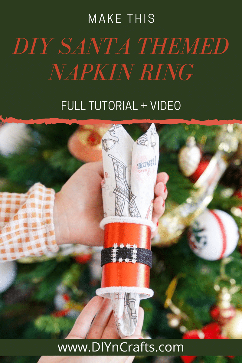 Santa napkin ring in front of Christmas tree