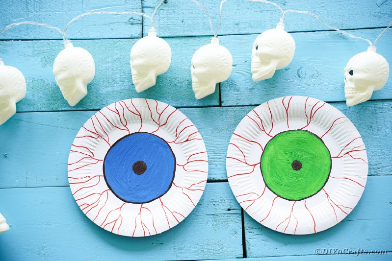Paper plate eyes on blue boards