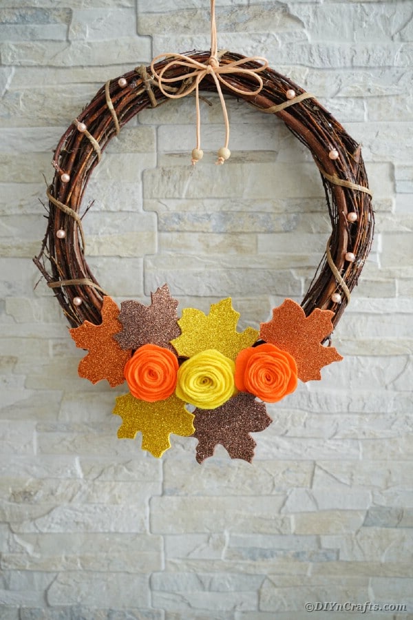 Grapevine wreath against brick wall
