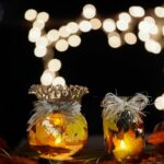 Fall leaf lanterns with candles lit