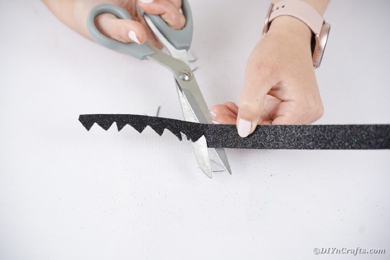 Cutting hair from black foam paper