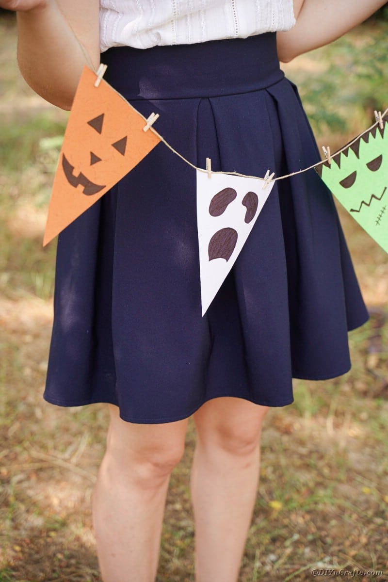 Woman holding Halloween garland