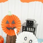 Halloween paper fans by black lantern