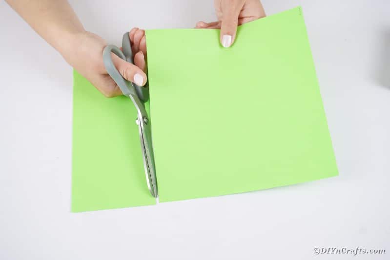 Cutting green paper