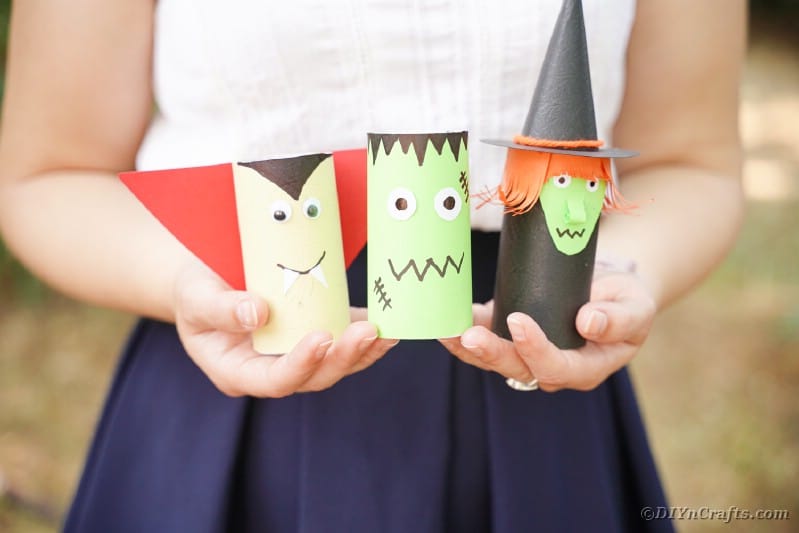 Woman holding toilet paper roll Halloween characters
