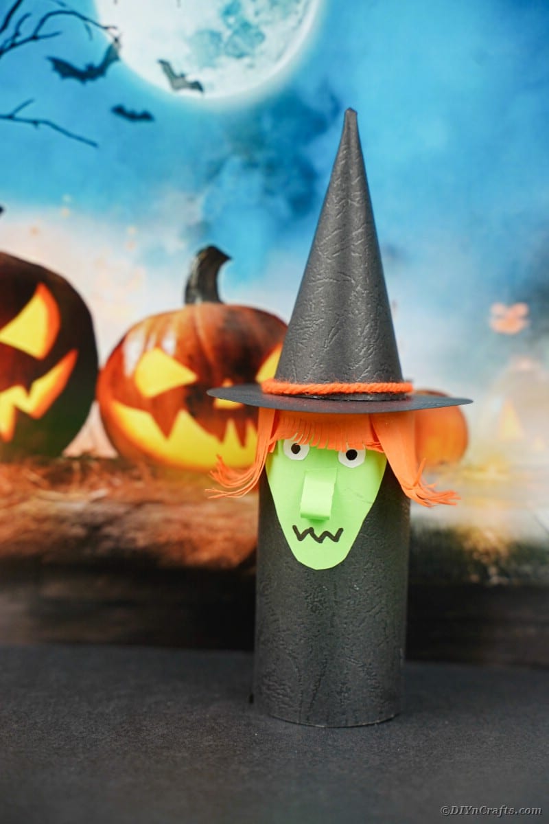 Toilet paper witch by Halloween background