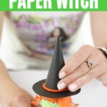 Adding a hat to a paper roll witch