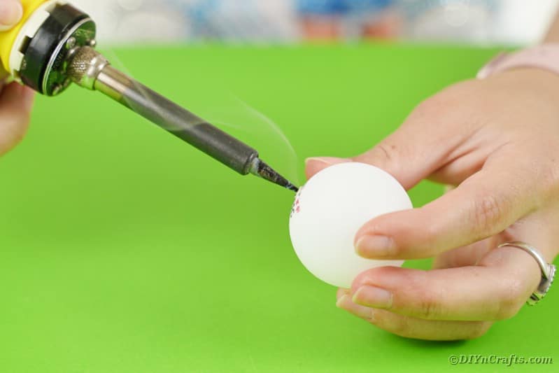 Cutting hole in ping pong ball
