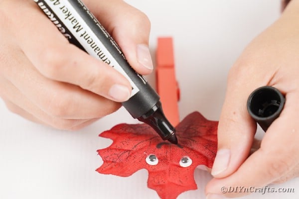 Drawing mouth on leaf people