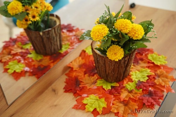 Stump flower pot on leaf placemat