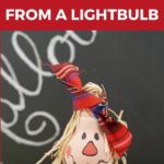 Lightbulb scarecrow on table by chalkboard