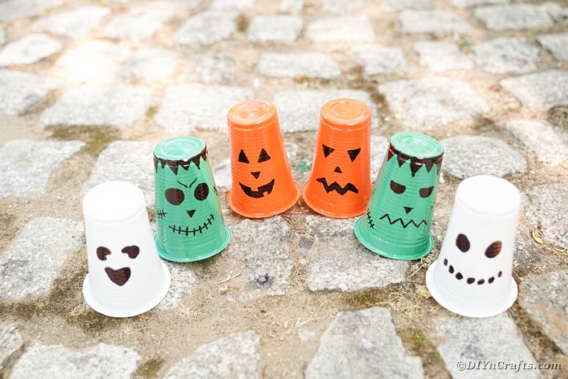 Halloween character lanterns on cobblestone