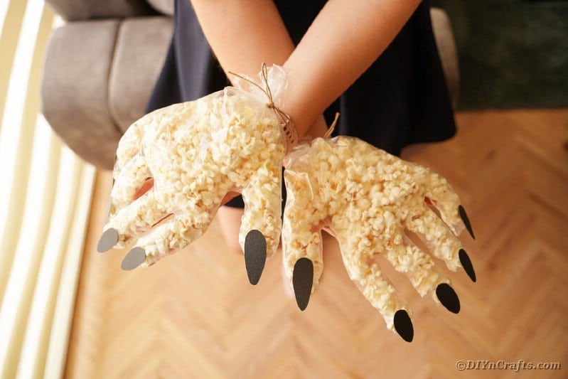 Woman holding popcorn hand
