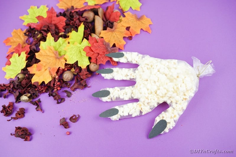 Popcorn hand on purple surface