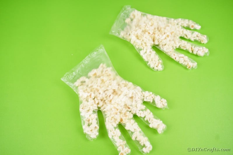 Two gloves filled with popcorn