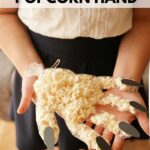 Woman holding popcorn hand