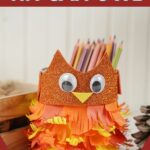 Tin can owl by wooden box
