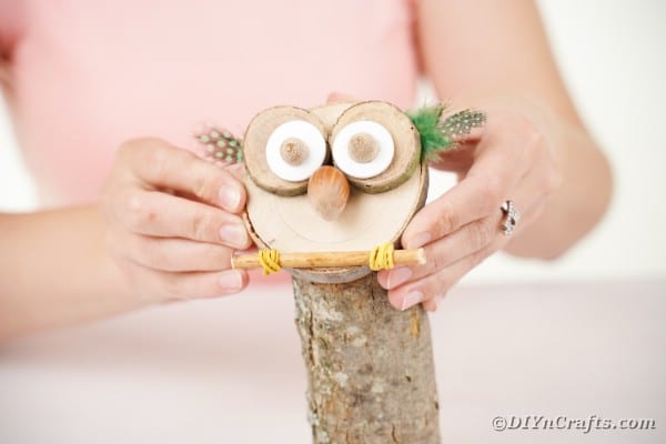 Gluing owl face to base of owl