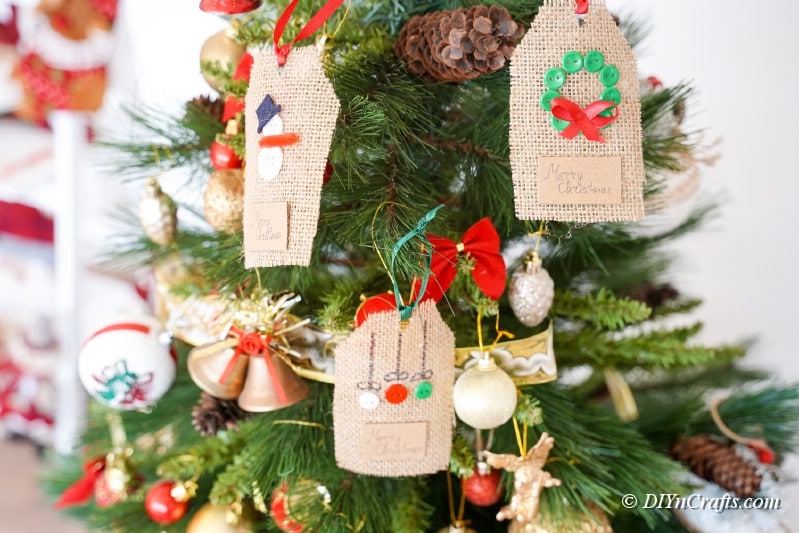 homemade gift tags ornaments hanging from Christmas tree 