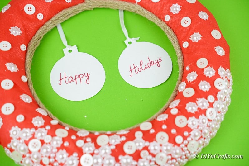 large wreath perfect for hanging with craft buttons