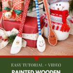 3 Painted wooden spoons under a Christmas tree