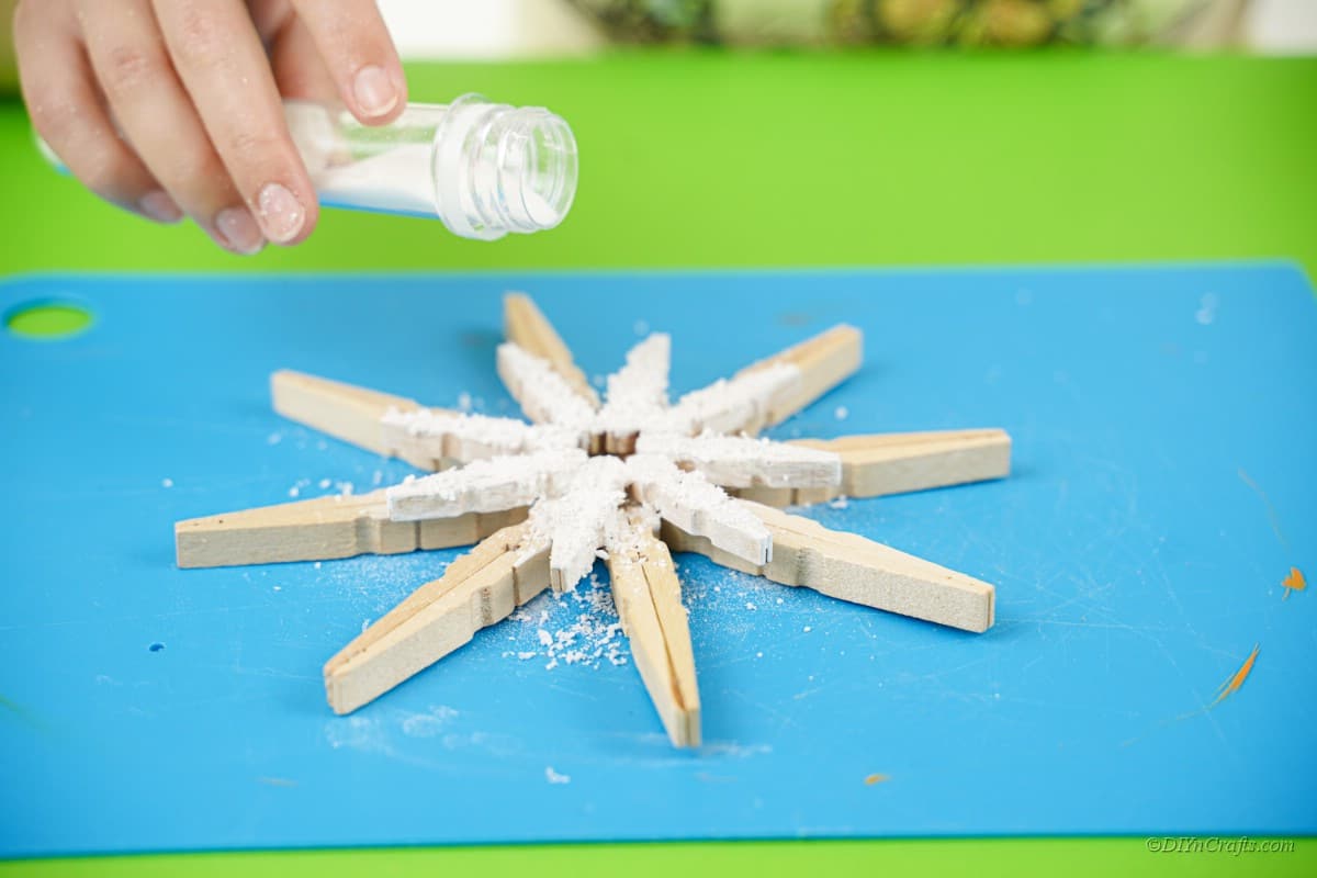 clothespin star design with fake snow