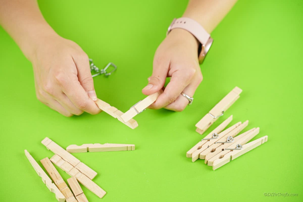 clothespins being separated by hands