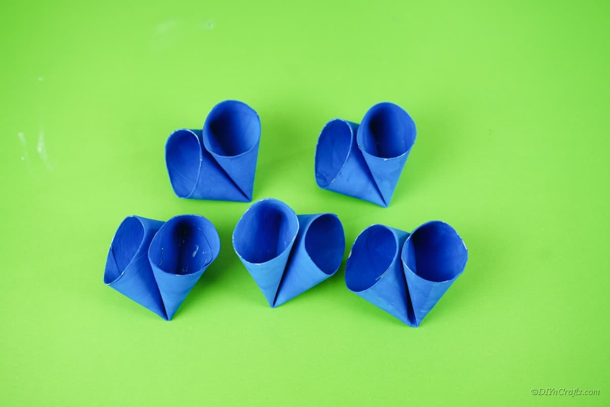 folded blue toilet paper rolls on table