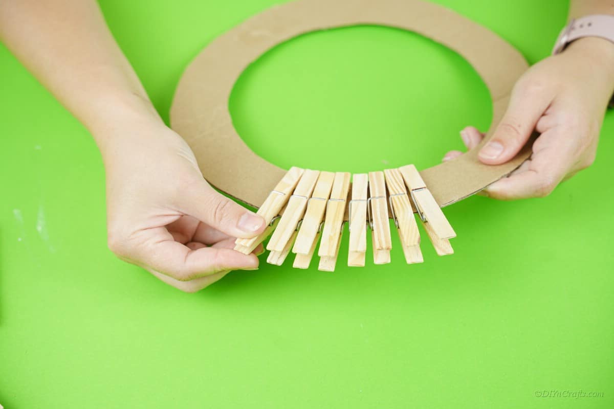 clothespins on cardboard ring 
