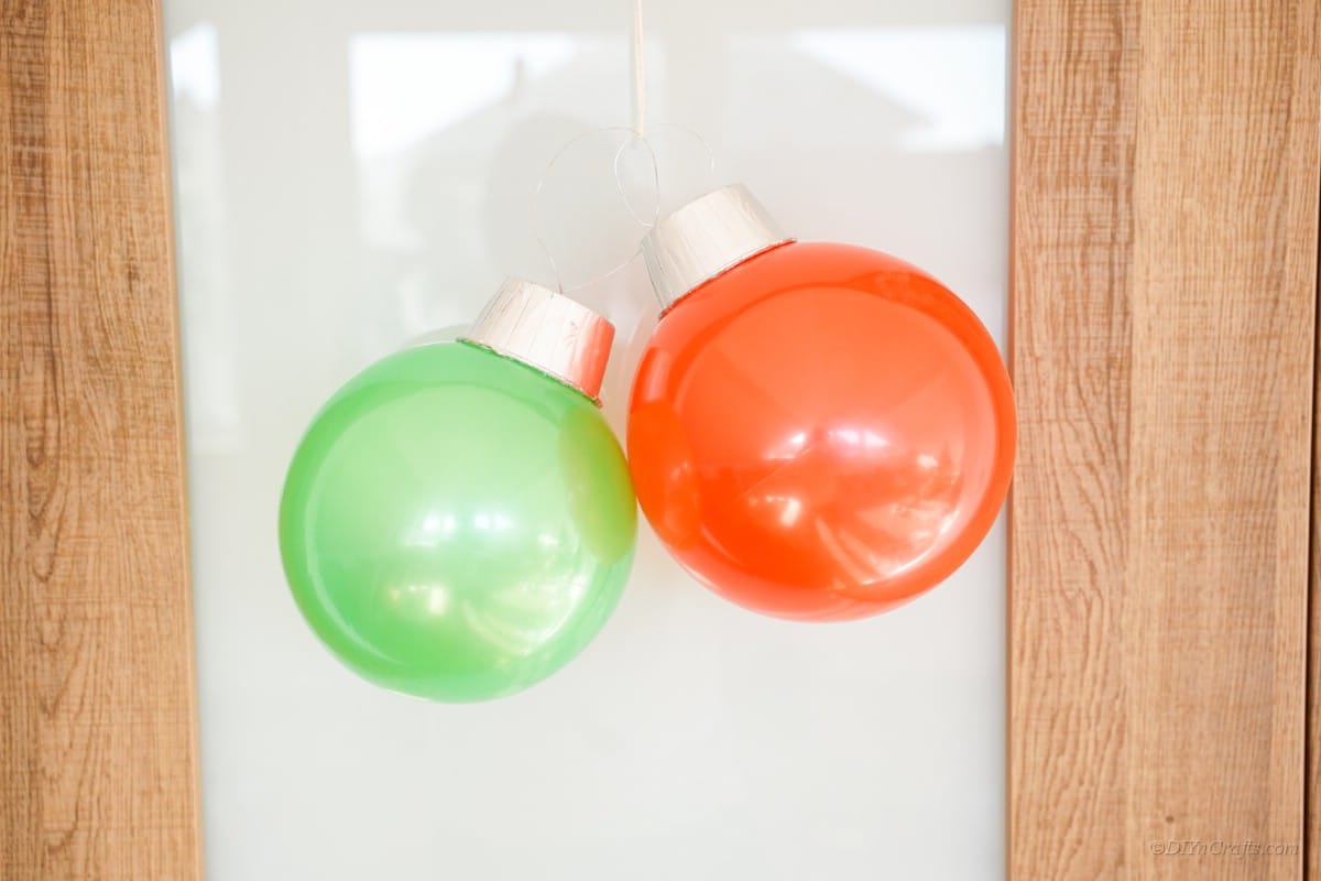 hanging Christmas ball ornament on door