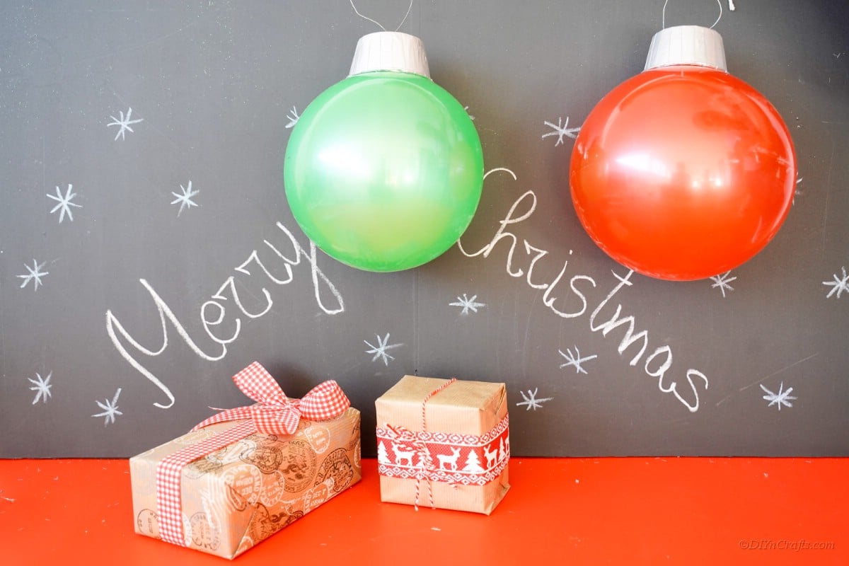 Chalkboard with ornament rubber balls and presents