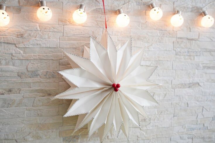 paper star craft hanging under lights