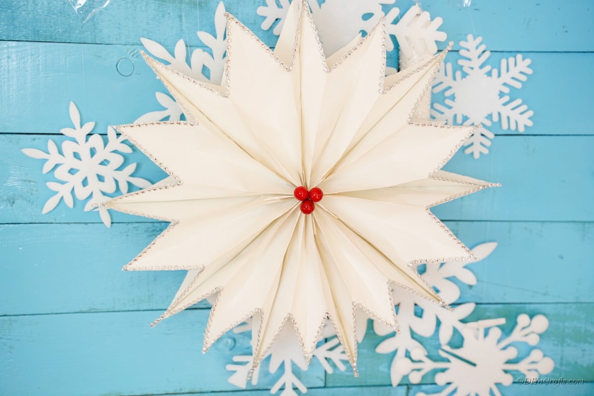 Giant star on a blue background with snowflake stars