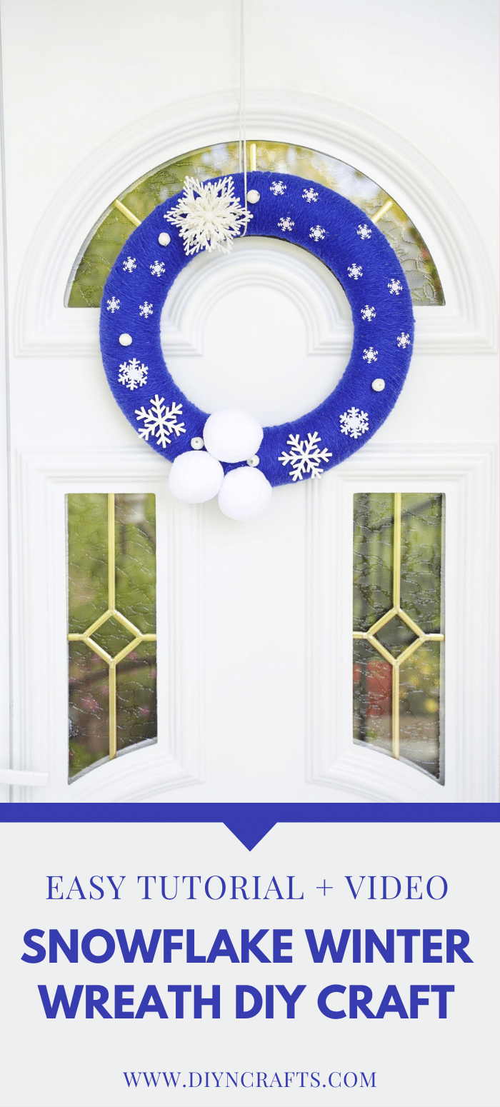 Blue snowflake wreath hanging on a door