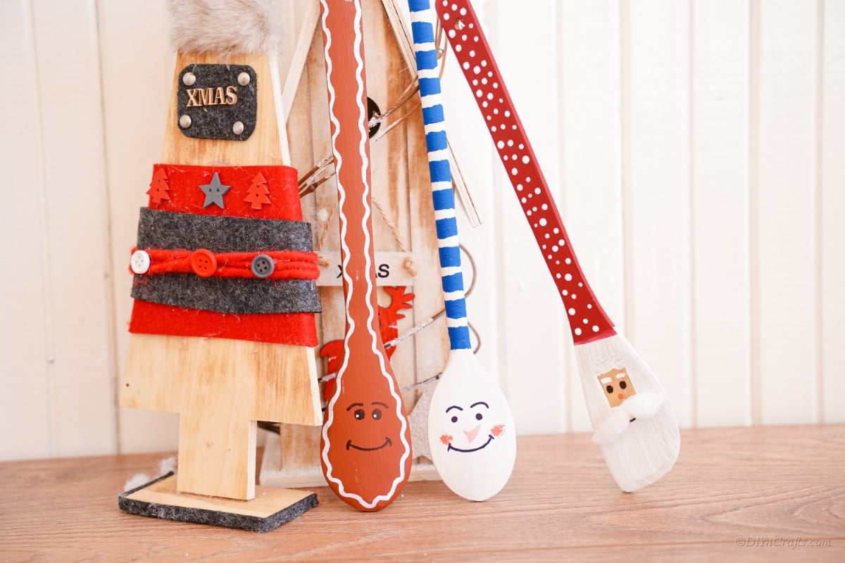 Wooden spoons leaning on Christmas decorations