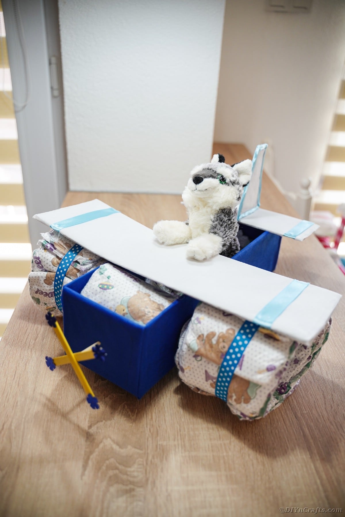Airplane diaper cake on table