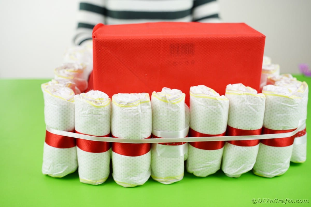 Wrapping diapers with ribbon