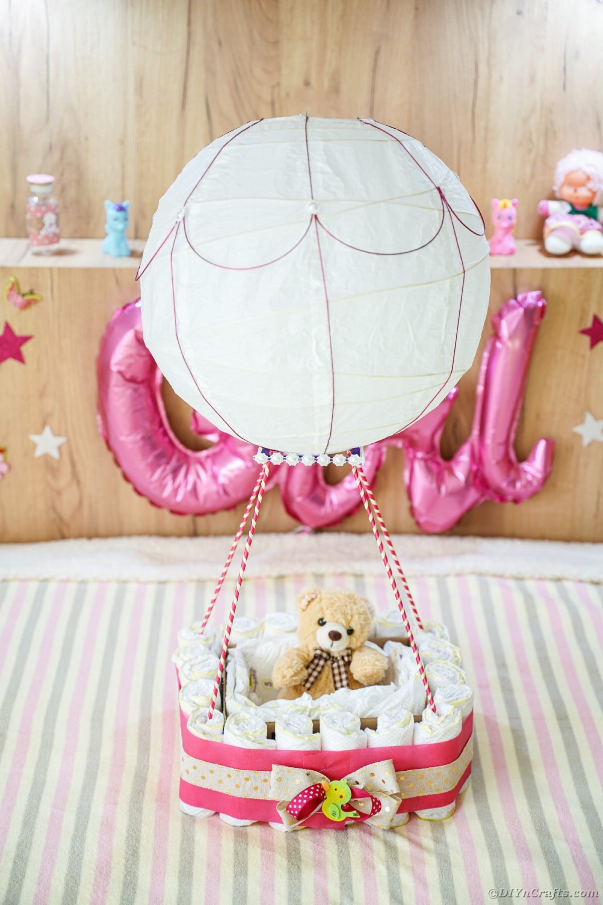 Diaper cake air balloon on bed
