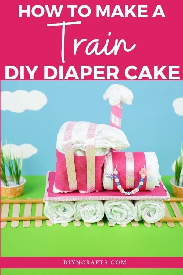 Diaper cake by blue background with clouds