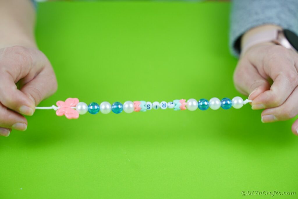 Length of beads on elastic