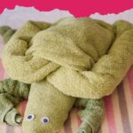 Towel turtle on bed