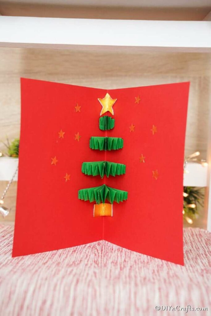 Red christmas card with tree