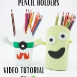 Monster pencil holders on white surface